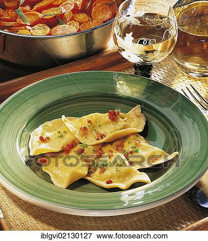 Carinthian cheese pasta, delicate pasta parcels filled with potatoes, cottage cheese and fresh herbs, fried with bacon, Austria, Europe View Large Photo Image Stock Photo - Carinthian cheese pasta, delicate pasta parcels filled with potatoes, cottage cheese and fresh herbs, fried with bacon, Austria, Europe. Fotosearch
