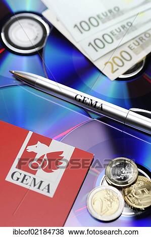 Stock Photo - CDs, banknotes and a pen labelled GEMA, symbolic image for GEMA fees. Fotosearch