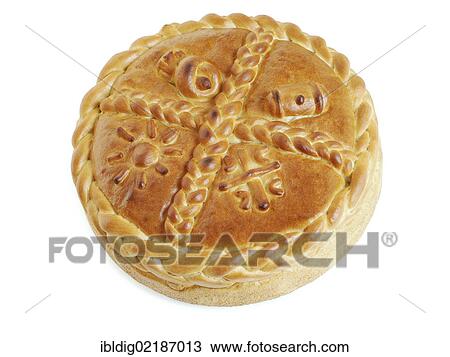Stock Image - Cesnica, Serbian Orthodox traditional Christmas bread which is broken during a ceremony to mark the Orthodox Christmas day on the 7th of January and rotated three times counterclockwise before being broken up by all the family members simultaneously. Fotosearch
