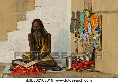 Chanting Sadhu reciting from the holy books at the ghats of Varanasi in the morning, Uttar Pradesh, India, Asia View Large Photo Image Stock Photograph - Chanting Sadhu reciting from the holy books at the ghats of Varanasi in the morning, Uttar Pradesh, India, Asia. Fotosearch
