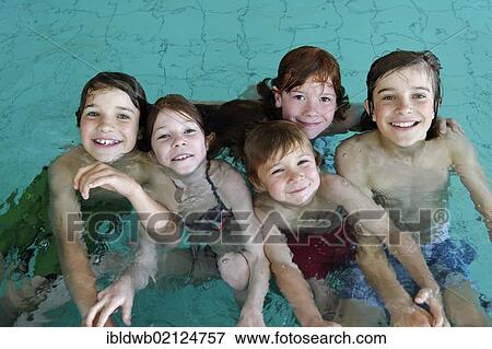 Children and teenagers in a swimming pool View Large Photo Image Stock Photo - Children and teenagers in a swimming pool. Fotosearch