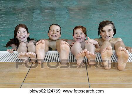 Children and teenagers in a swimming pool View Large Photo Image Stock Photo - Children and teenagers in a swimming pool. Fotosearch