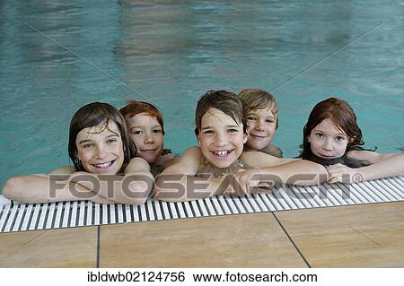 Children and teenagers in a swimming pool View Large Photo Image Stock Photograph - Children and teenagers in a swimming pool. Fotosearch