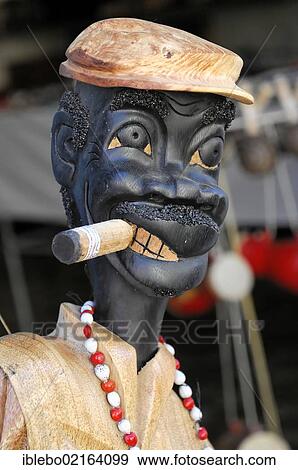 Cigar smoking carved wooden figure, souvenirs, Trinidad, Cuba, Greater Antilles, Caribbean, Central America, America, North America View Large Photo Image Stock Photo - Cigar smoking carved wooden figure, souvenirs, Trinidad, Cuba, Greater Antilles, Caribbean, Central America, America, North America. Fotosearch