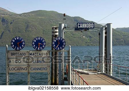 Clocks displaying departure times at the Cannobio jetty on Lake Maggiore, Piedmont, Italy, Europe View Large Photo Image Stock Photo - Clocks displaying departure times at the Cannobio jetty on Lake Maggiore, Piedmont, Italy, Europe. Fotosearch
