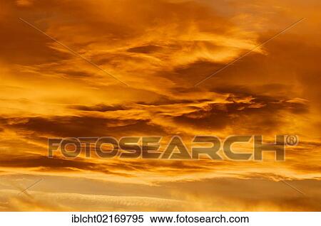 Stock Photography - Clouds in the sky at dawn, North Rhine-Westphalia, Germany, Europe. Fotosearch