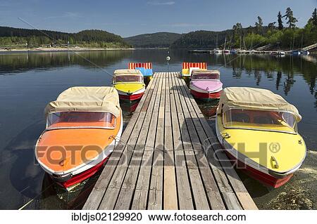 Colourful boats docked on a wharf, Schluchsee lake, Black Forest, Baden-Wuerttemberg, Germany, Europe View Large Photo Image Stock Image - Colourful boats docked on a wharf, Schluchsee lake, Black Forest, Baden-Wuerttemberg, Germany, Europe. Fotosearch