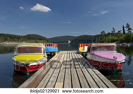 Colourful boats docked on a wharf, Schluchsee lake, Black Forest, Baden-Wuerttemberg, Germany, Europe View Large Photo Image Stock Image - Colourful boats docked on a wharf, Schluchsee lake, Black Forest, Baden-Wuerttemberg, Germany, Europe. Fotosearch