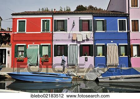 Colourful painted houses, boats in the canal of Burano, Burano Island in the lagoon of Venice, Italy, Europe View Large Photo Image Stock Image - Colourful painted houses, boats in the canal of Burano, Burano Island in the lagoon of Venice, Italy, Europe. Fotosearch