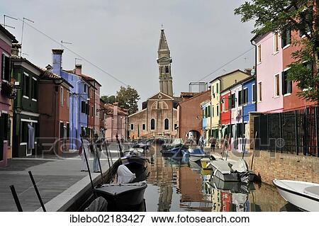 Colourful painted houses, boats in the canal of Burano, leaning church steeple, Burano Island in the lagoon of Venice, Italy, Europe View Large Photo Image Stock Photo - Colourful painted houses, boats in the canal of Burano, leaning church steeple, Burano Island in the lagoon of Venice, Italy, Europe. Fotosearch