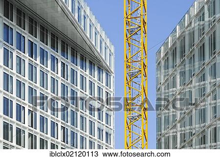 Construction site at Ericusspitze, construction crane between two new office buildings, HafenCity, Hamburg, Germany, Europe View Large Photo Image Stock Image - Construction site at Ericusspitze, construction crane between two new office buildings, HafenCity, Hamburg, Germany, Europe. Fotosearch