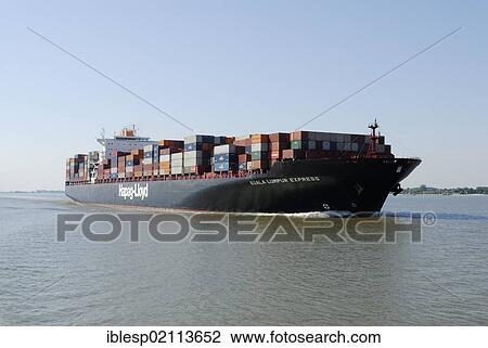 Stock Image - Container ship on the Elbe River, Schleswig-Holstein, Germany, Europe. Fotosearch