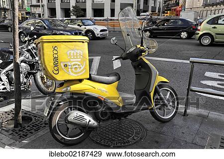 Correos, moped, motor scooter of a postal delivery worker, Madrid, Spain, Europe View Large Photo Image Stock Photo - Correos, moped, motor scooter of a postal delivery worker, Madrid, Spain, Europe. Fotosearch