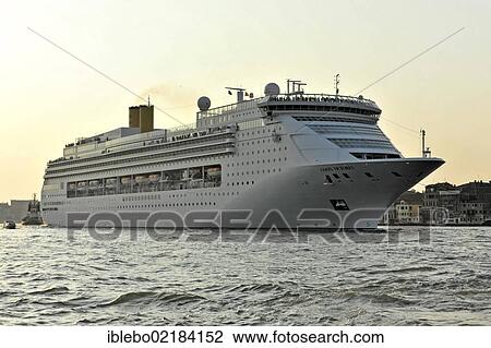 Stock Image - Costa Victoria, cruise ship, built in 1996, 252. 5 m, 2370 passengers, departing, with a tugboat at the rear, Venice, Veneto, Italy, Europe. Fotosearch