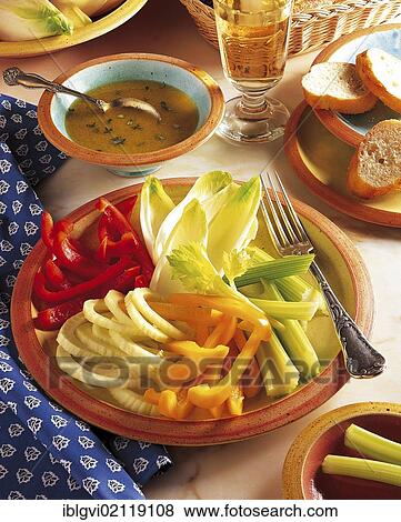 Stock Photo - Crudités with anchovy dip, fennel, peppers, celery and chicory, cold starter, France, Europe. Fotosearch