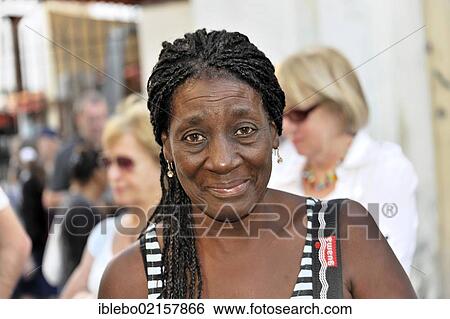 Stock Photograph - Cuban woman, portrait, Central Havana, Centro Habana, Cuba, Greater Antilles, Caribbean, Central America, America, North America. Fotosearch