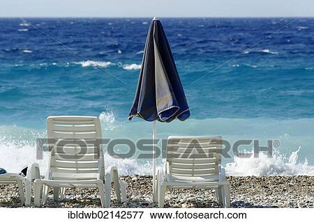 Deck chairs and parasol on the beach, Kokkari, Samos island, southern Sporades, Aegean sea, Greece, Europe View Large Photo Image Stock Photo - Deck chairs and parasol on the beach, Kokkari, Samos island, southern Sporades, Aegean sea, Greece, Europe. Fotosearch