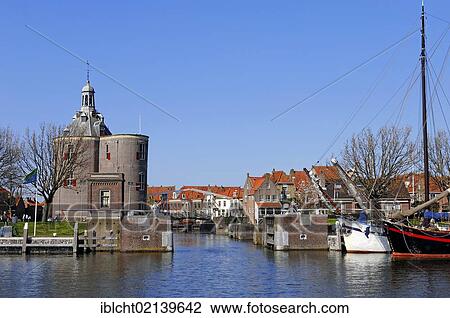 Stock Image - Defence tower, Dromedaris and ships in the harbour, Enkhuizen, North Holland, Holland, Netherlands, Europe. Fotosearch