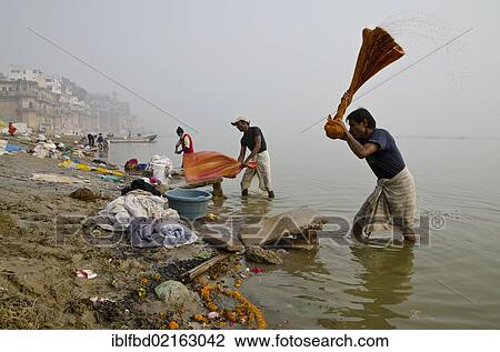 Dhobi walas, people of the laundry cast, doing laundry at the ghats along the holy river Ganges, Varanasi, Uttar Pradesh, India, Asia View Large Photo Image Stock Image - Dhobi walas, people of the laundry cast, doing laundry at the ghats along the holy river Ganges, Varanasi, Uttar Pradesh, India, Asia. Fotosearch