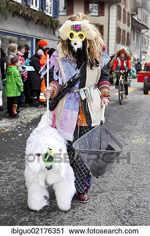 Stock Image - Dog breeder with a dog, costume, 35th Motteri-Umzug parade in Malters, Lucerne, Switzerland, Europe. Fotosearch