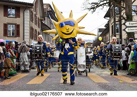 Drum major of a Guggenmusik group, carnival marching band, dressed as the sun, 35th Motteri parade in Malters, Lucerne, Switzerland, Europe View Large Photo Image Stock Photo - Drum major of a Guggenmusik group, carnival marching band, dressed as the sun, 35th Motteri parade in Malters, Lucerne, Switzerland, Europe. Fotosearch