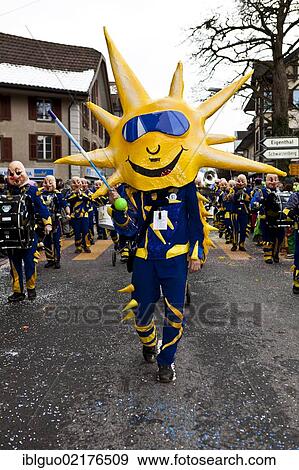 Drum major of a Guggenmusik group, carnival marching band, dressed as the sun, 35th Motteri parade in Malters, Lucerne, Switzerland, Europe View Large Photo Image Stock Photo - Drum major of a Guggenmusik group, carnival marching band, dressed as the sun, 35th Motteri parade in Malters, Lucerne, Switzerland, Europe. Fotosearch