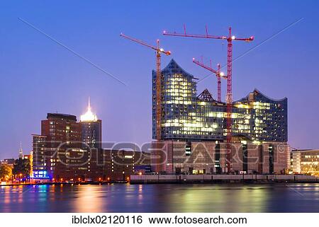 Stock Photograph - Elbe Philharmonic Hall, construction site at dusk, HafenCity, Hamburg, Germany, Europe. Fotosearch