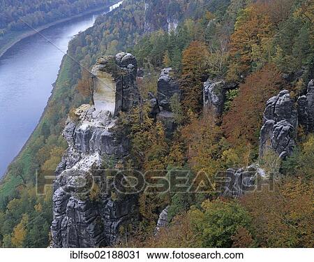 Elbe river and rock fractures at Wartturm rock tower, Elbe Sandstone Mountains, Elbsandsteingebirge, Saxon Switzerland National Park, Saxony, Germany, Europe View Large Photo Image Stock Image - Elbe river and rock fractures at Wartturm rock tower, Elbe Sandstone Mountains, Elbsandsteingebirge, Saxon Switzerland National Park, Saxony, Germany, Europe. Fotosearch