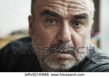 Stock Photo - Elderly man, direct view, portrait. Fotosearch