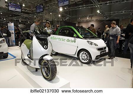 Stock Image - Electric car, Smart Electric Drive with Escooter on display at the Vienna Auto Show 2012, car show, Vienna, Austria, Europe. Fotosearch