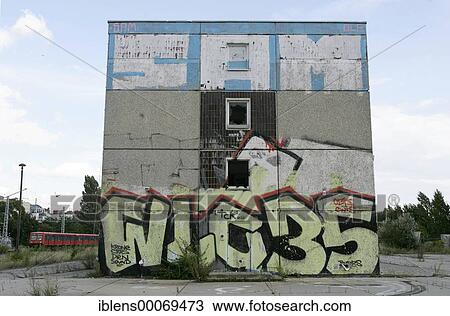 Stock Image - Empty block of flats with graffiti on it in East Berlin. Fotosearch