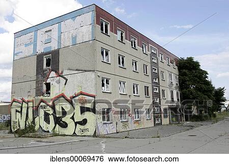 Stock Photograph - Empty block of flats with graffiti on it in East Berlin. Fotosearch