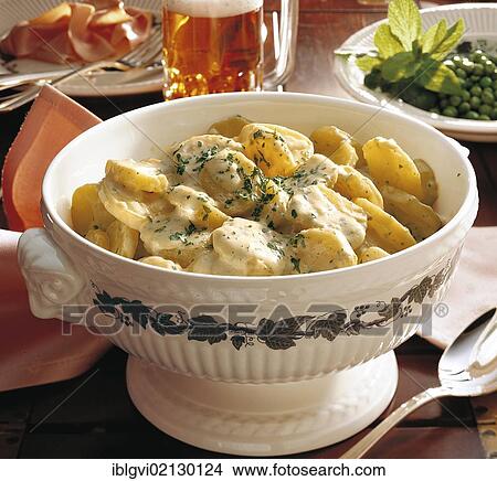 Picture - English parsley potatoes, potato slices in a creamy sauce, United Kingdom, Europe. Fotosearch