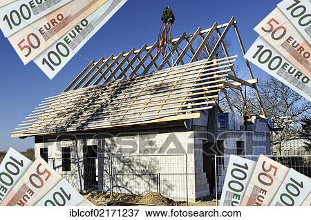Euro banknotes in front of a house under construction, symbolic image for construction costs View Large Photo Image Stock Photo - Euro banknotes in front of a house under construction, symbolic image for construction costs. Fotosearch