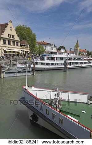 Stock Image - Excursion boats on the lakeside promenade, Lindau, Lake Constance, Baden-Wuerttemberg, southern Germany, Germany, Europe. Fotosearch