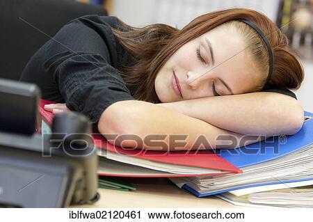 Exhausted office worker resting head on files and folders View Large Photo Image Stock Image - Exhausted office worker resting head on files and folders. Fotosearch
