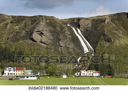 Farms in front of a waterfall, Kirkjubaerjaklaustur, South Iceland, Iceland, Northern Europe, Europe View Large Photo Image Stock Image - Farms in front of a waterfall, Kirkjubaerjaklaustur, South Iceland, Iceland, Northern Europe, Europe. Fotosearch