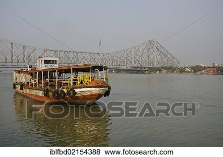 Ferry boat connecting Kolkata and Howrah, in front of the 705 m long Howrah Bridge, Kolkata, West Bengal, India, Asia View Large Photo Image Stock Photo - Ferry boat connecting Kolkata and Howrah, in front of the 705 m long Howrah Bridge, Kolkata, West Bengal, India, Asia. Fotosearch