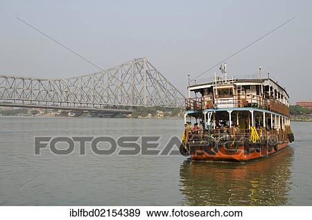 Ferry boat connecting Kolkata and Howrah, in front of the 705 m long Howrah Bridge, Kolkata, West Bengal, India, Asia View Large Photo Image Stock Photo - Ferry boat connecting Kolkata and Howrah, in front of the 705 m long Howrah Bridge, Kolkata, West Bengal, India, Asia. Fotosearch