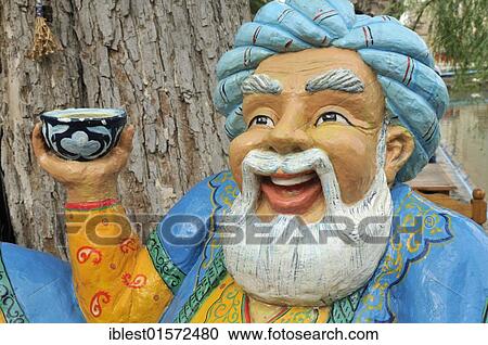 Figure of a funny Uzbek man holding a cup of tea, historic town of Bukhara, Buchara, Silk Road, Unesco World Heritage Site, Central Asia View Large Photo Image Stock Image - Figure of a funny Uzbek man holding a cup of tea, historic town of Bukhara, Buchara, Silk Road, Unesco World Heritage Site, Central Asia. Fotosearch
