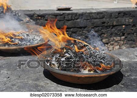 Stock Photo - Fire in a dish, Pashupatinath, Kathmandu, Nepal, Asia. Fotosearch
