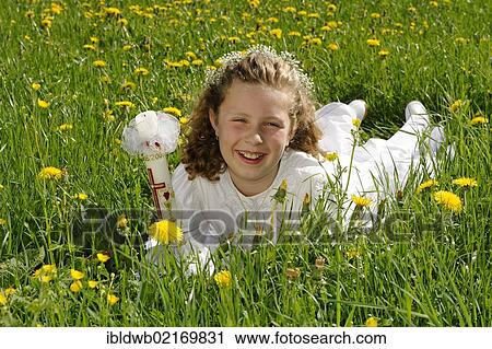 First communion girl with a white dress lying in a meadow View Large Photo Image Stock Image - First communion girl with a white dress lying in a meadow. Fotosearch