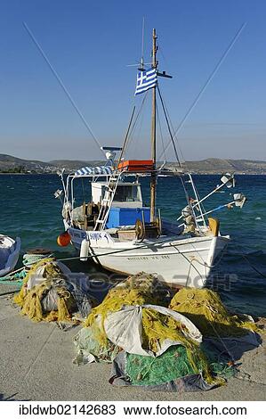 Fishing boat in the harbor of Ireon Iraio Samou, Samos island, southern Sporades, Aegean sea, Greece, Europe View Large Photo Image Stock Image - Fishing boat in the harbor of Ireon Iraio Samou, Samos island, southern Sporades, Aegean sea, Greece, Europe. Fotosearch