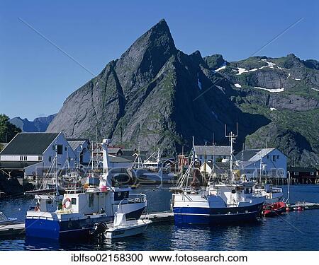 Stock Image - Fishing boats in the harbour of Hamnøya, Moskenesøya Island, Lofoten Islands, Norway, Scandinavia, Europe. Fotosearch