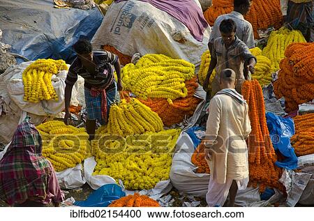 Stock Image - Flower garlands for sale at the flower market of Kolkata, West Bengal, India, Asia. Fotosearch