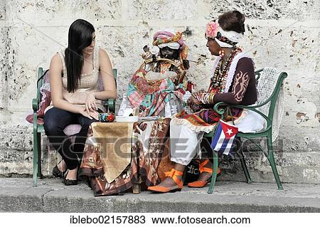 Fortune teller with a tourist, Plaza de la Catedral, Havana, Cuba, Greater Antilles, Caribbean, Central America, America, North America View Large Photo Image Stock Image - Fortune teller with a tourist, Plaza de la Catedral, Havana, Cuba, Greater Antilles, Caribbean, Central America, America, North America. Fotosearch
