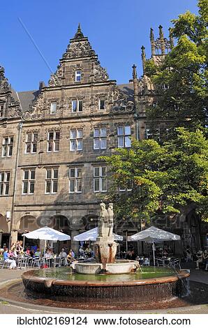 Picture - Fountain in front of a sidewalk cafe in Muenster, Muensterland, North Rhine-Westphalia, Germany, Europe, PublicGround, Europe. Fotosearch