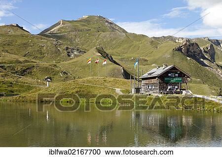 Stock Image - Fuscher Lacke lake, 2262m above sea level, and restaurant, Grossglockner High Alpine Road, Hohe Tauern National Park, Austria, Europe. Fotosearch