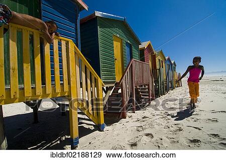 Girl and boy on a beach, colourful beach houses, Muizenberg, Western Cape, South Africa, Africa View Large Photo Image Stock Photo - Girl and boy on a beach, colourful beach houses, Muizenberg, Western Cape, South Africa, Africa. Fotosearch