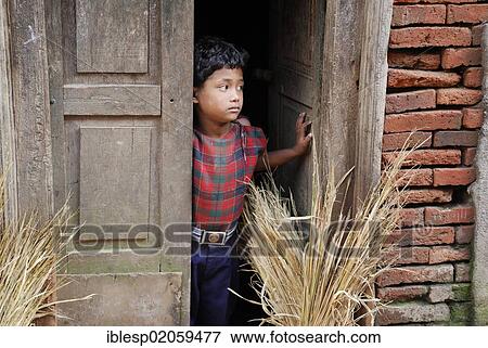 Girl looking out of door, Bhaktapur, Kathmandu Valley, Nepal, Asia View Large Photo Image Stock Photo - Girl looking out of door, Bhaktapur, Kathmandu Valley, Nepal, Asia. Fotosearch